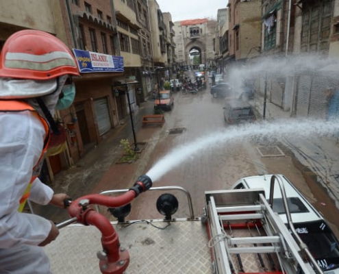 Pakistani rescue workers spray disinfectants in an effort to curb the spread of corona virus outbreak in Peshawar, Pakistan.